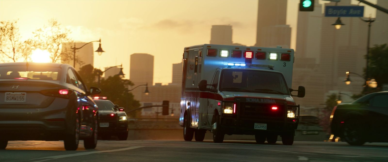 an ambulance is driving down a city street