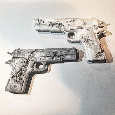 a couple of guns that are on a wall