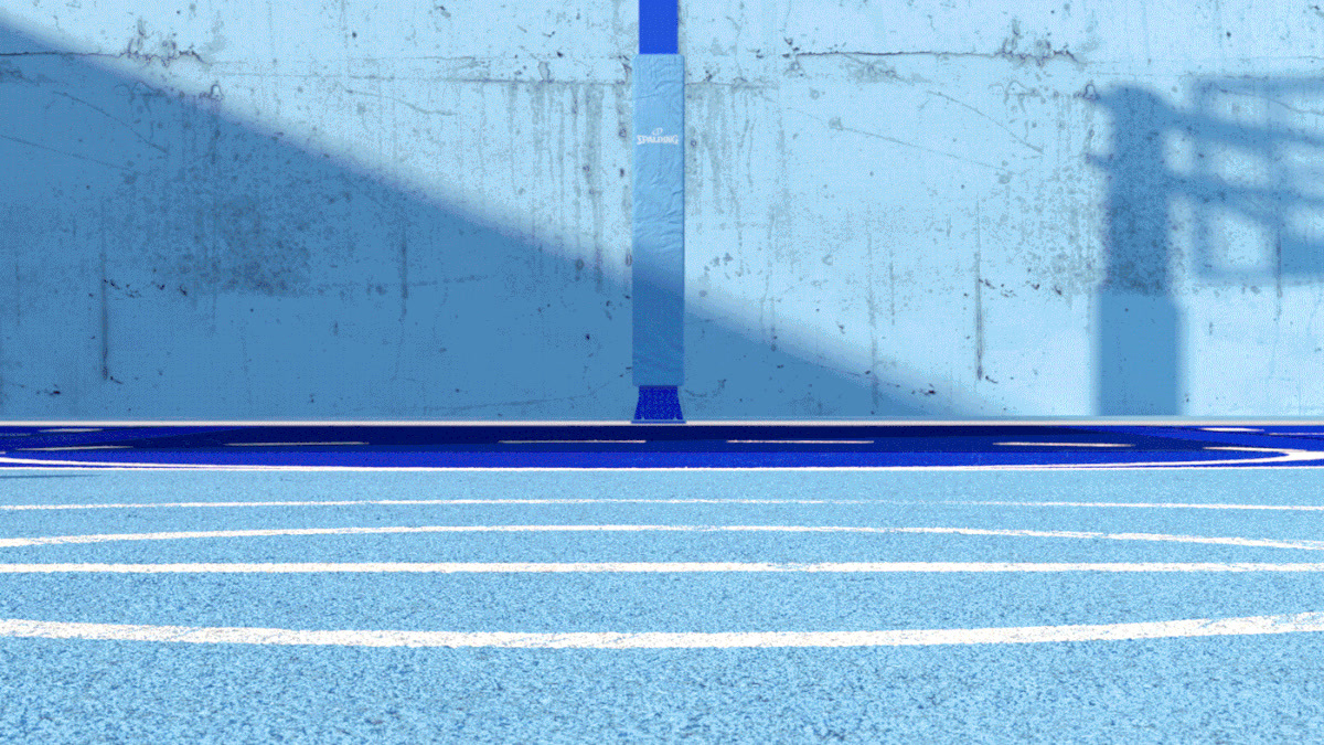 a tennis court with a blue wall and white lines