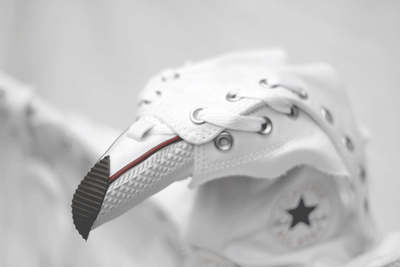 a white shoe with a black star on it