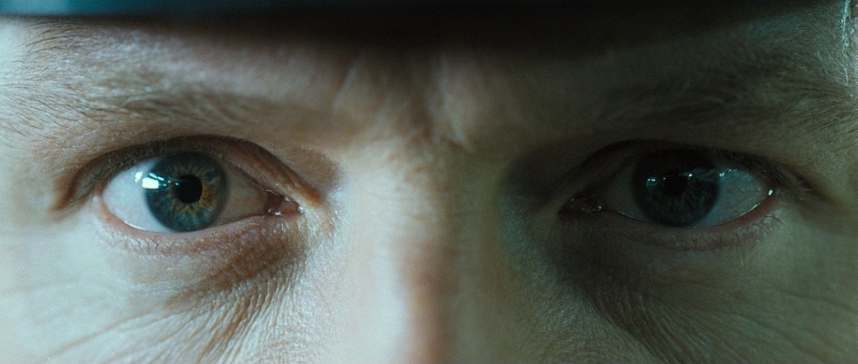 a close up of a person's eyes with a blurry background