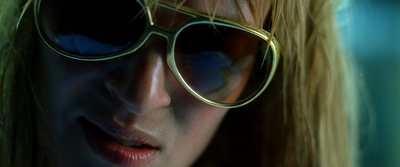 a close up of a person wearing sunglasses