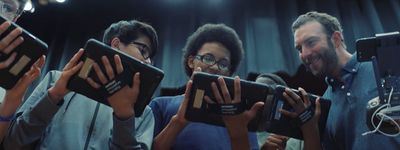 a group of people holding up their cell phones