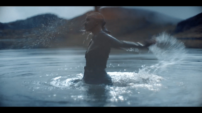 a woman standing in a body of water