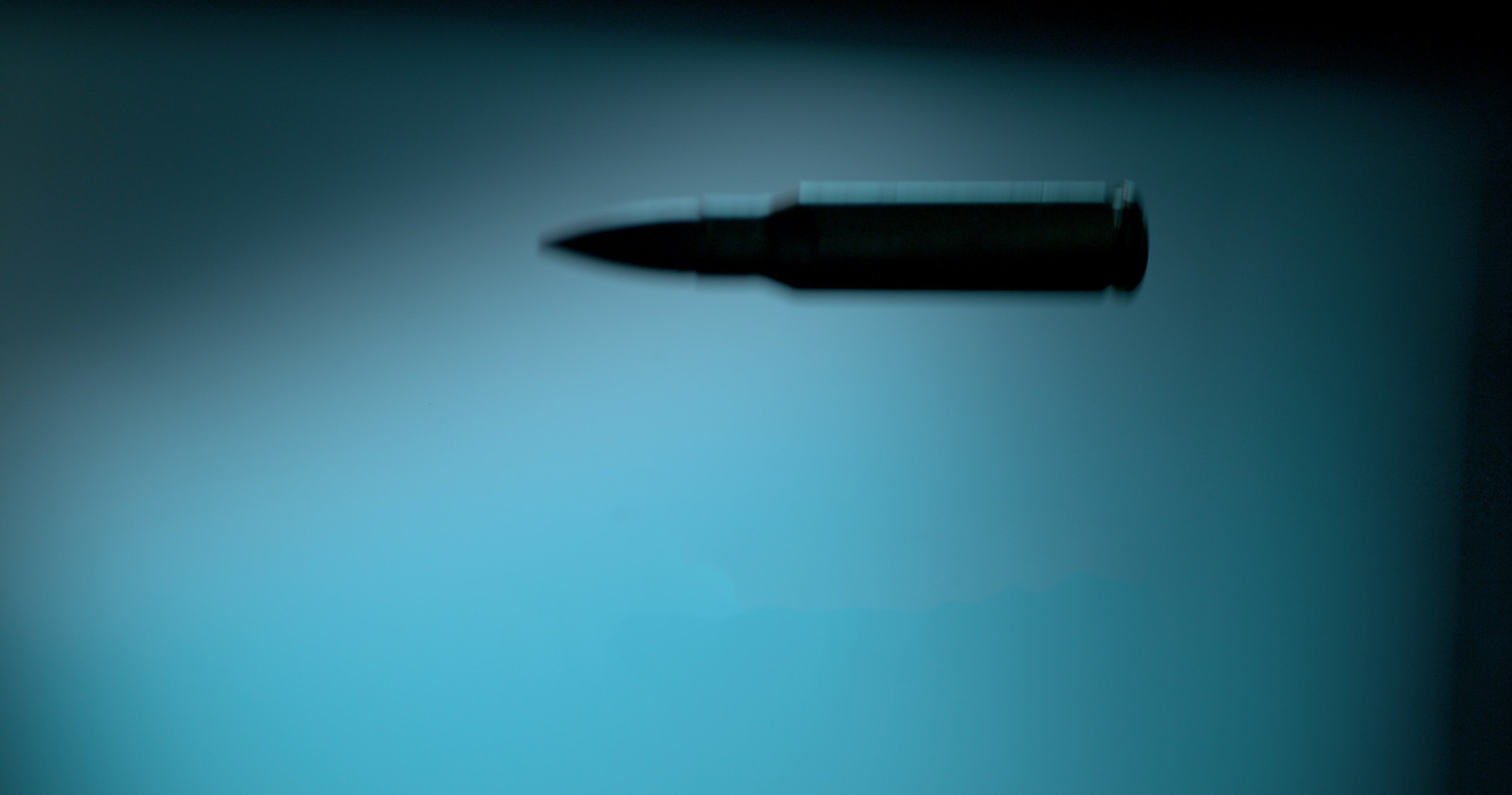 a close up of a pen on a blue background