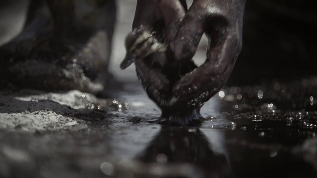 a close up of a person's hands in the water