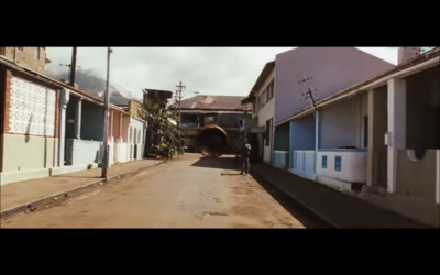 a man is standing in the middle of a street