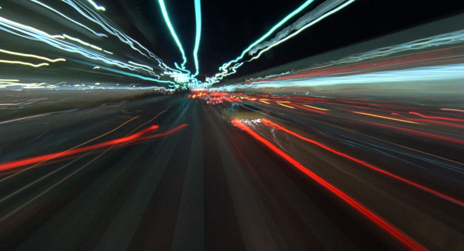 a blurry photo of a city street at night