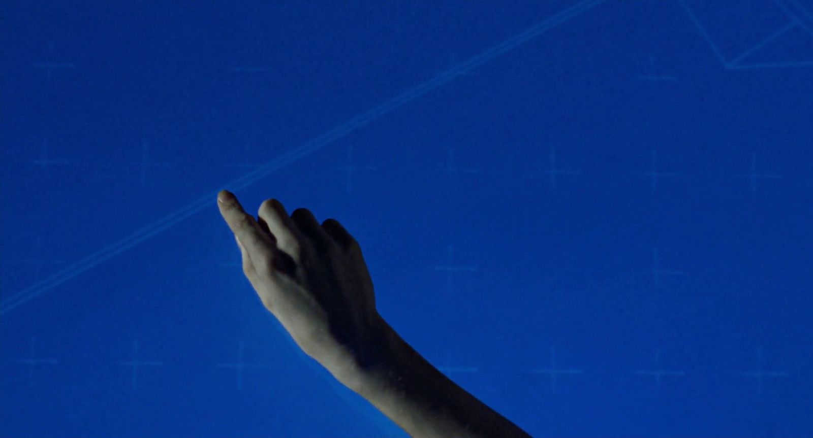 a person's hand reaching up into the sky