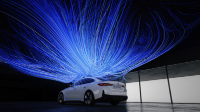 a car parked in front of a building with blue lights