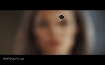 a blurry image of a woman's face with a hole in the middle