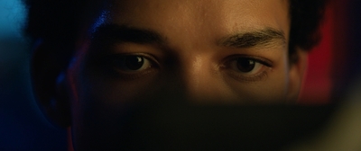 a close up of a person's face with a blurry background