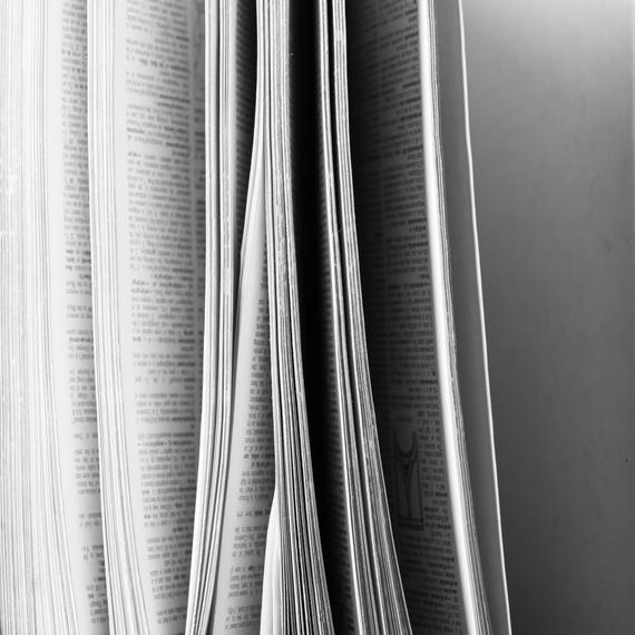 a close up of an open book on a table