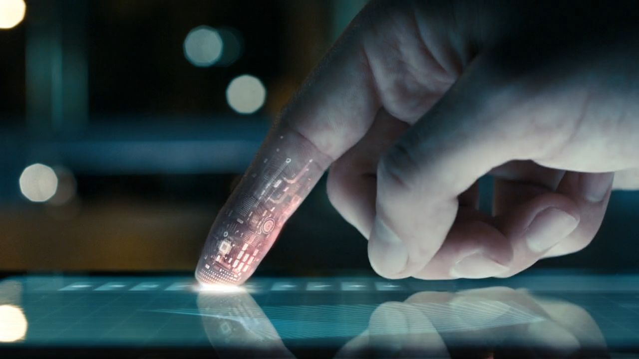 a person using a tablet with a light shining on it