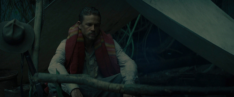 a man with a hat and a scarf on