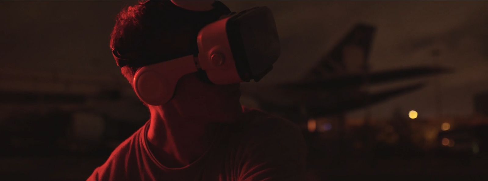 a man in a red shirt wearing a red blindfold