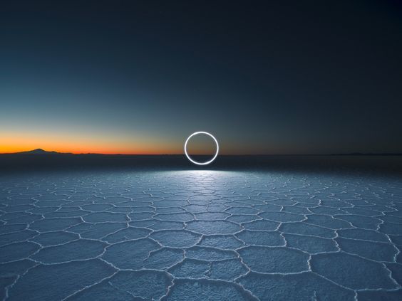 a photo of a circle in the middle of a desert