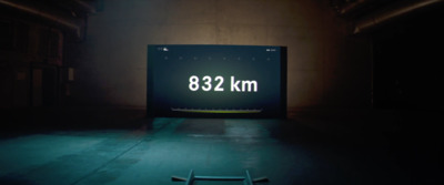 a sign that reads 822 km in a dark room