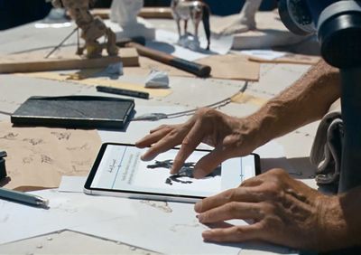 a person using a tablet on top of a table