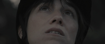 a close up of a person wearing a hat