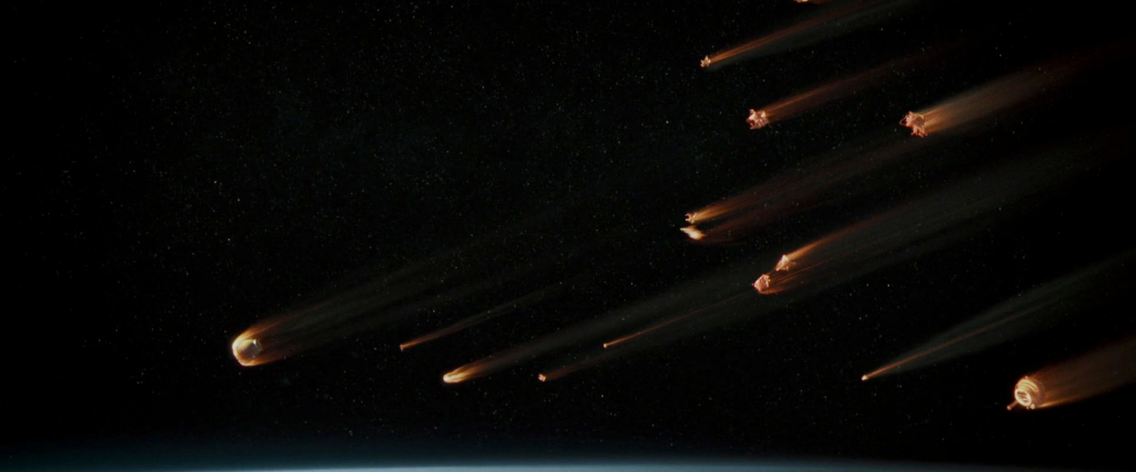 a group of rockets flying over the earth