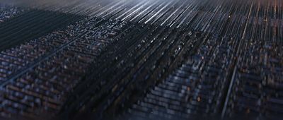 a close up of a metal grate with a blurry background