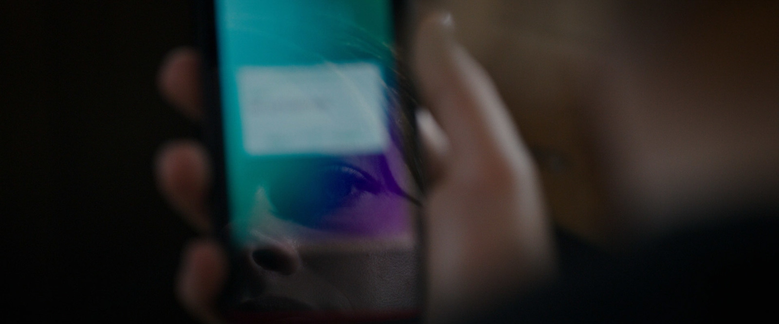 a close up of a person holding a cell phone