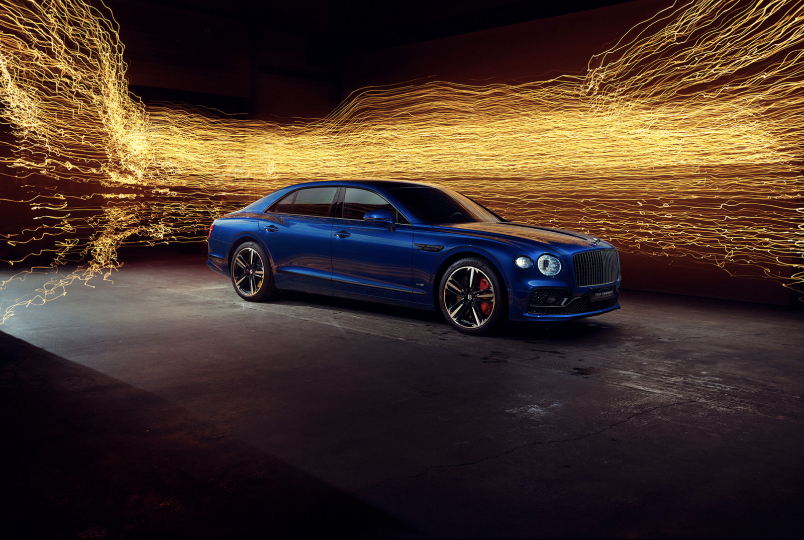 a blue sports car parked in a garage