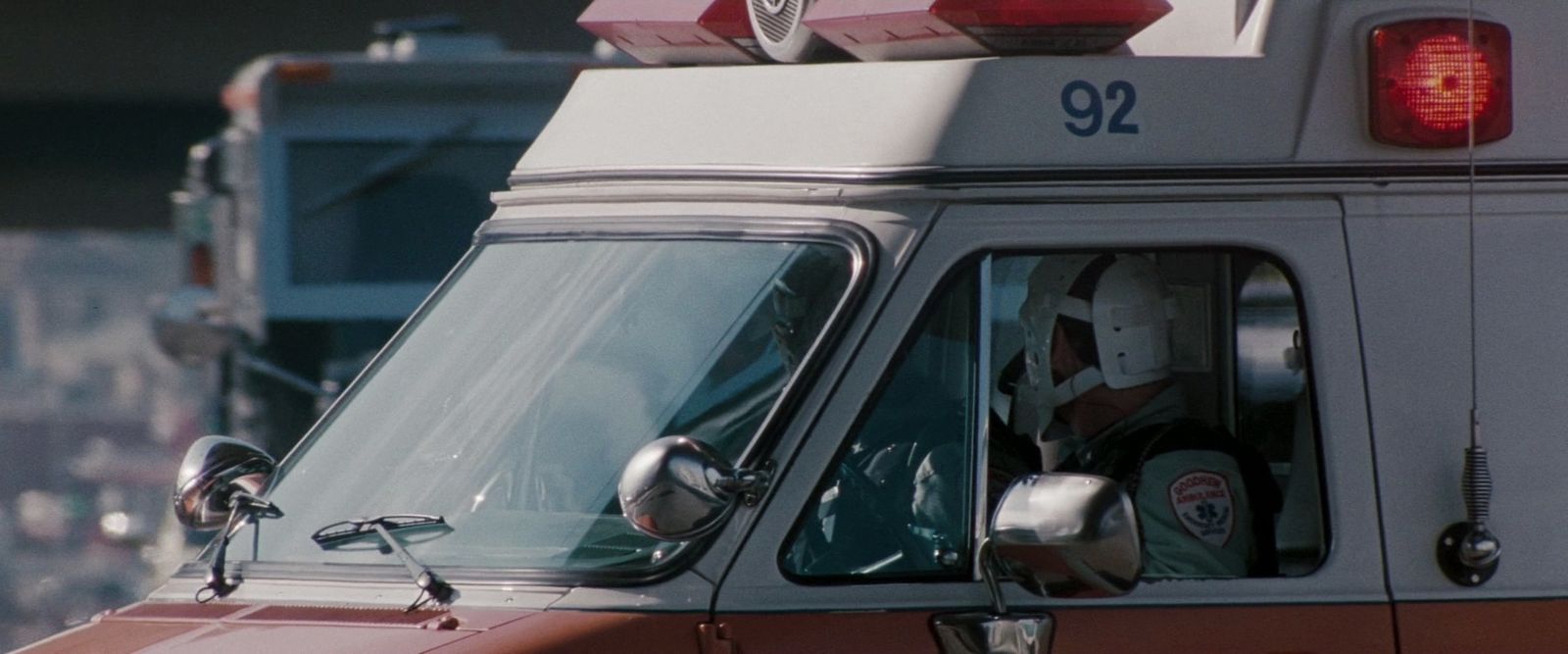 a fire truck with a fireman sitting in the driver's seat