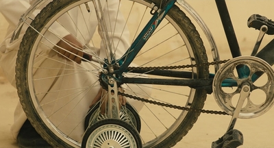 a close up of a bike with a person sitting on it