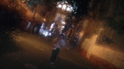 a blurry photo of a person walking down a street