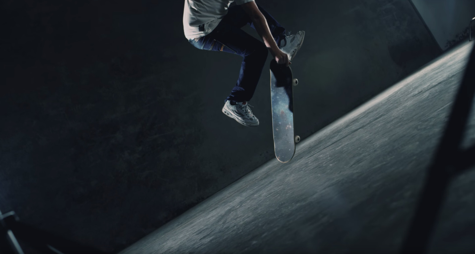 a man flying through the air while riding a skateboard