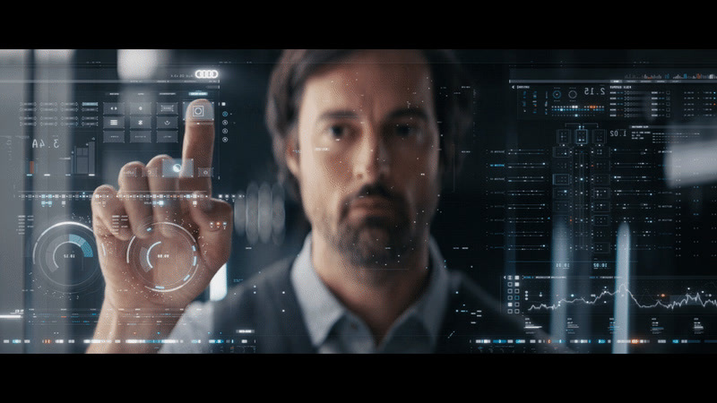 a man touching a virtual interface with his finger