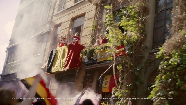 a group of people standing on top of a building