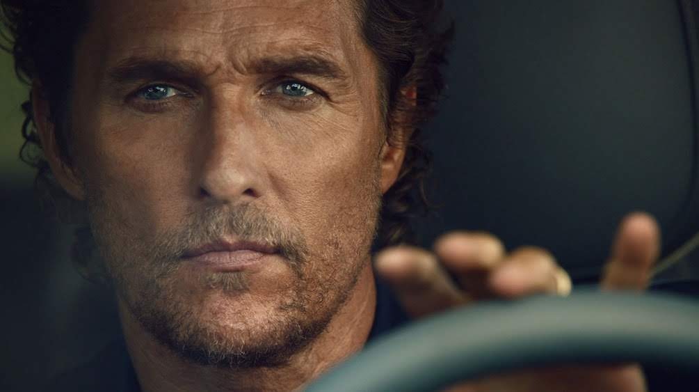 a close up of a person driving a car