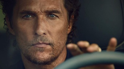 a close up of a person driving a car