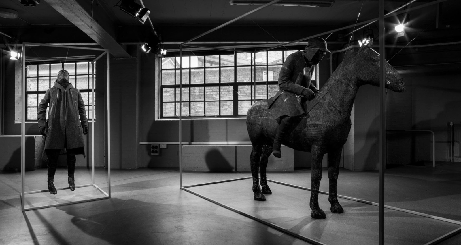 a black and white photo of a horse in a room