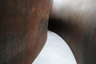 a man riding a skateboard down a metal wall