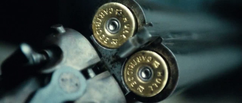 a close up of two bullet casings on a gun