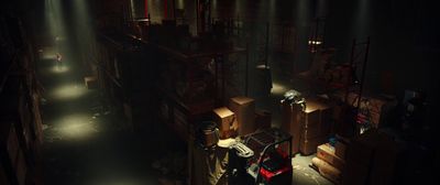 a dimly lit room with a lot of boxes