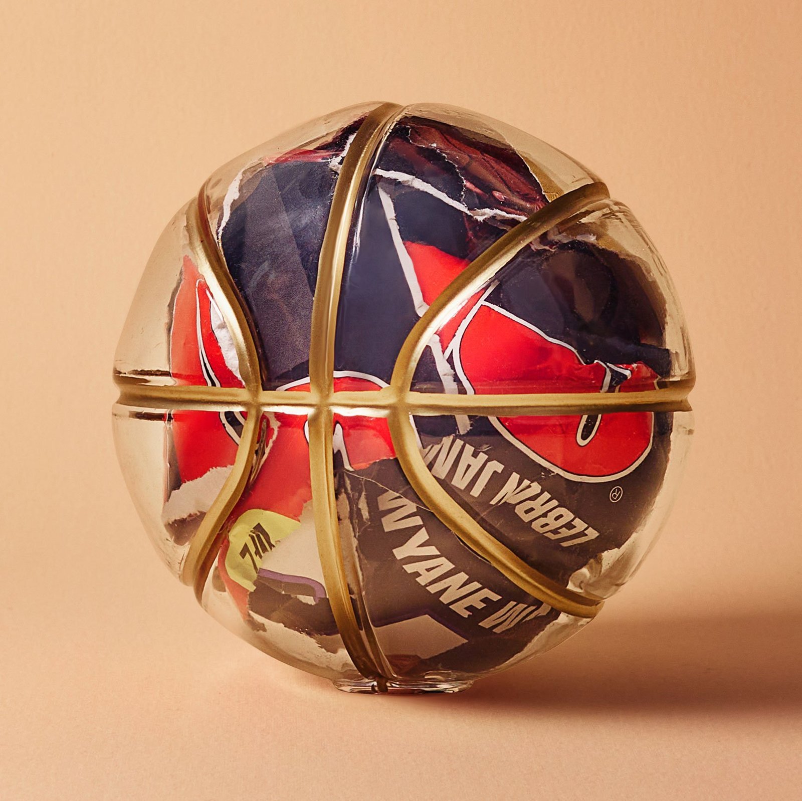 a glass ball with a gold wire wrapped around it