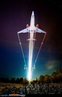 a space shuttle flying through the night sky