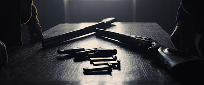 a pair of scissors sitting on top of a wooden table