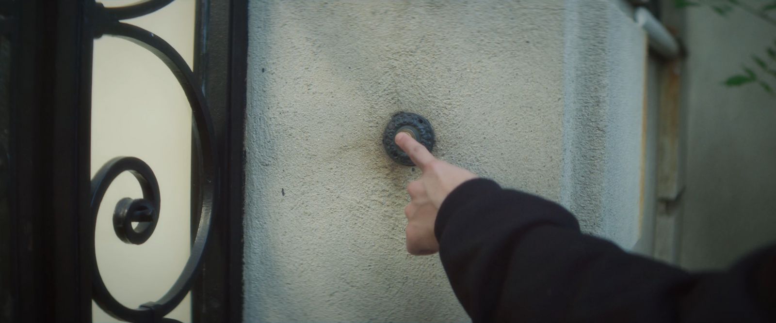 a person pointing at something on a wall