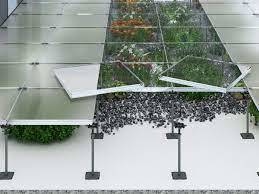 a glass table with plants growing inside of it