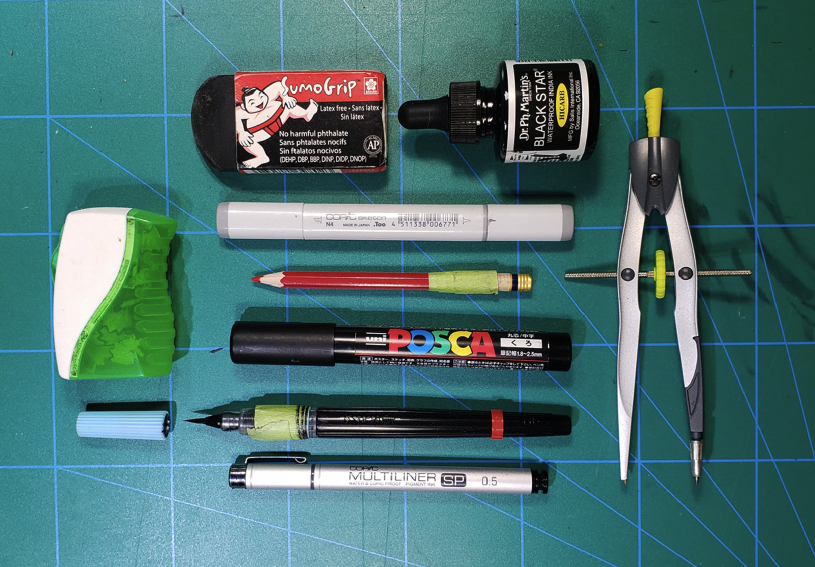 a couple of pens and some other items on a table