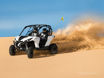 a person riding a four - wheeler in the desert