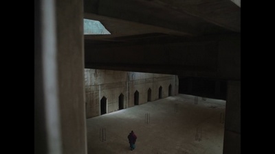 a person standing in a room with a ceiling