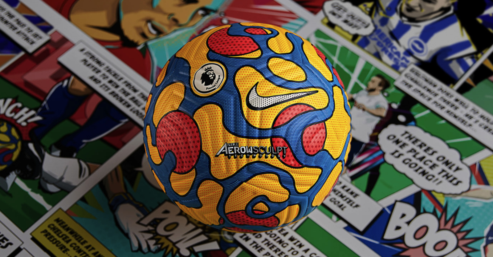 a yellow and blue ball sitting on top of a pile of stickers