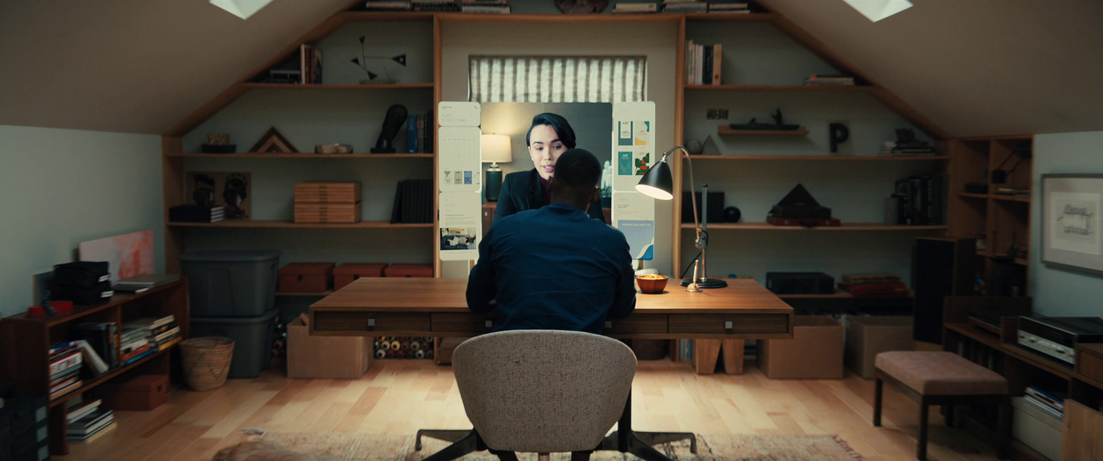 a person sitting at a desk in a room